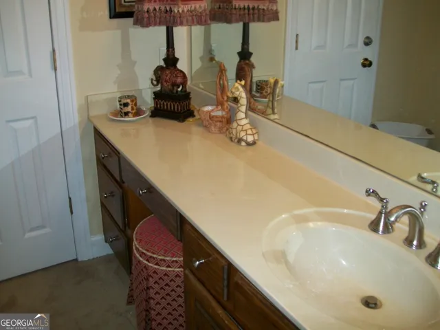 a bathroom with a double vanity sink