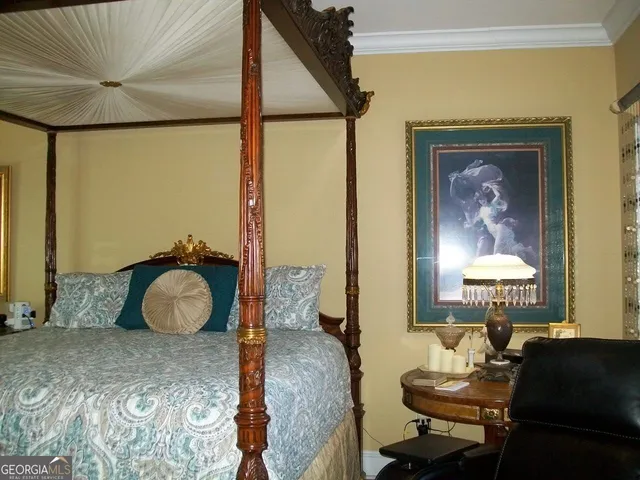 a bedroom with furniture and a window