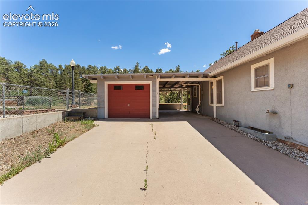 7755 Topeka Avenue Cascade, CO 80809 - Photo 3 of 38 One car garage with room for a workshop at front end