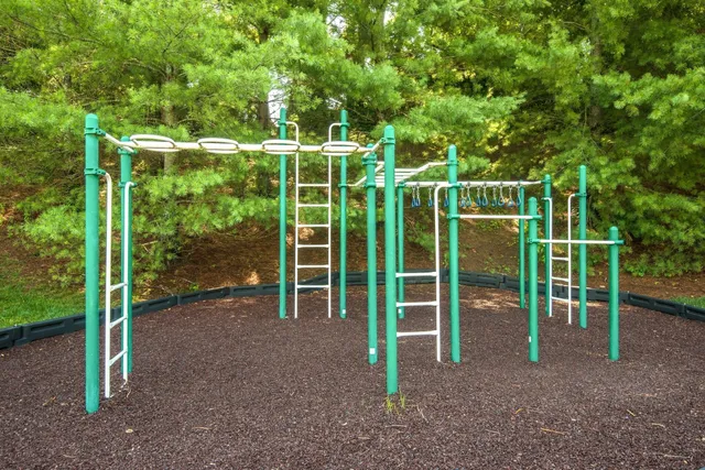 a view of a yard with wooden fence