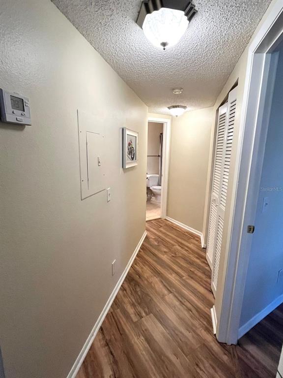 1550 South Belcher Road, Unit 524 Clearwater, FL 33764 - Photo 14 of 45 a view of a hallway with wooden floor