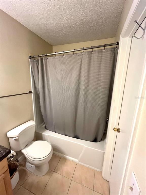 1550 South Belcher Road, Unit 524 Clearwater, FL 33764 - Photo 20 of 45 a white toilet sitting next to a shower curtain