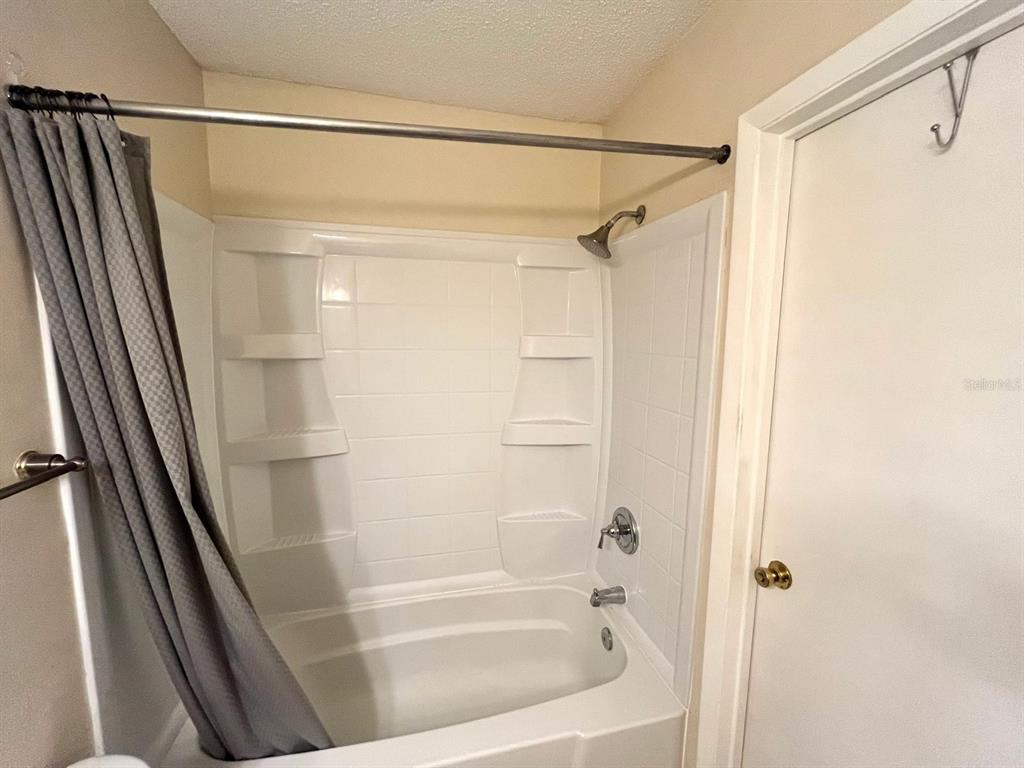 1550 South Belcher Road, Unit 524 Clearwater, FL 33764 - Photo 21 of 45 a bathroom with a shower and a tub