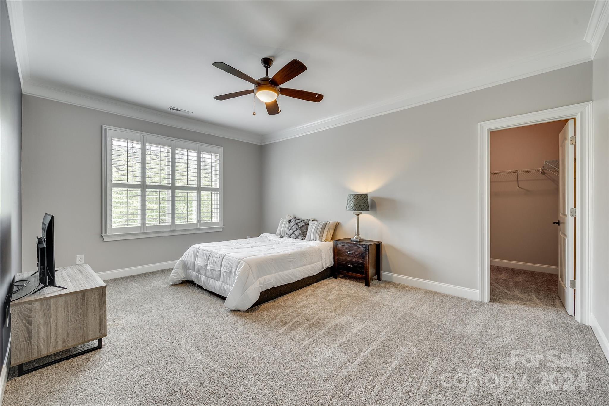 620 Pomegranate Place Fort Mill, SC 29708 - Photo 24 of 48 a spacious bedroom with a bed and a window