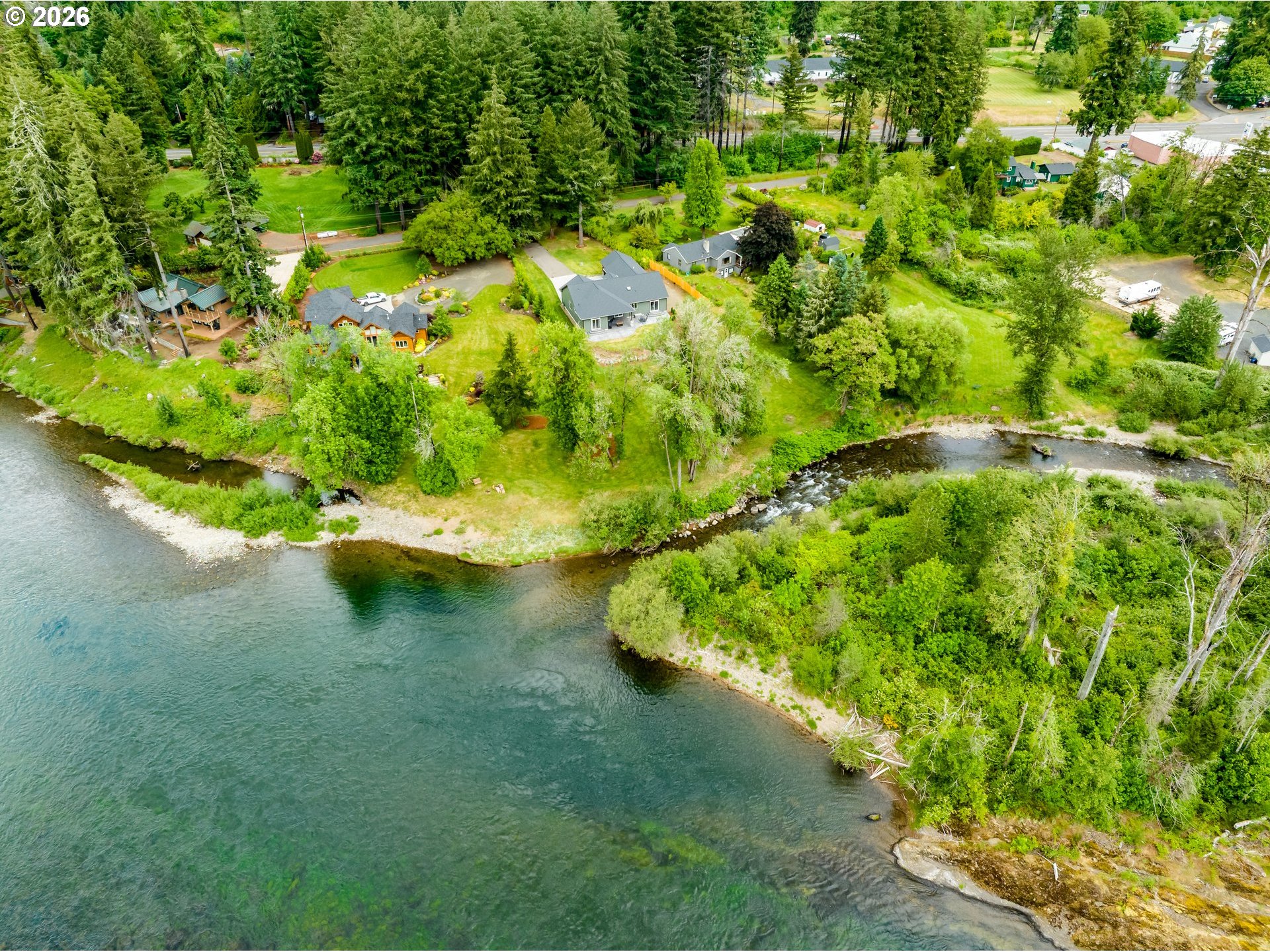 45542 South Gate Creek Road Vida, OR 97488 - Photo 16 of 46 a view of a lake with a yard