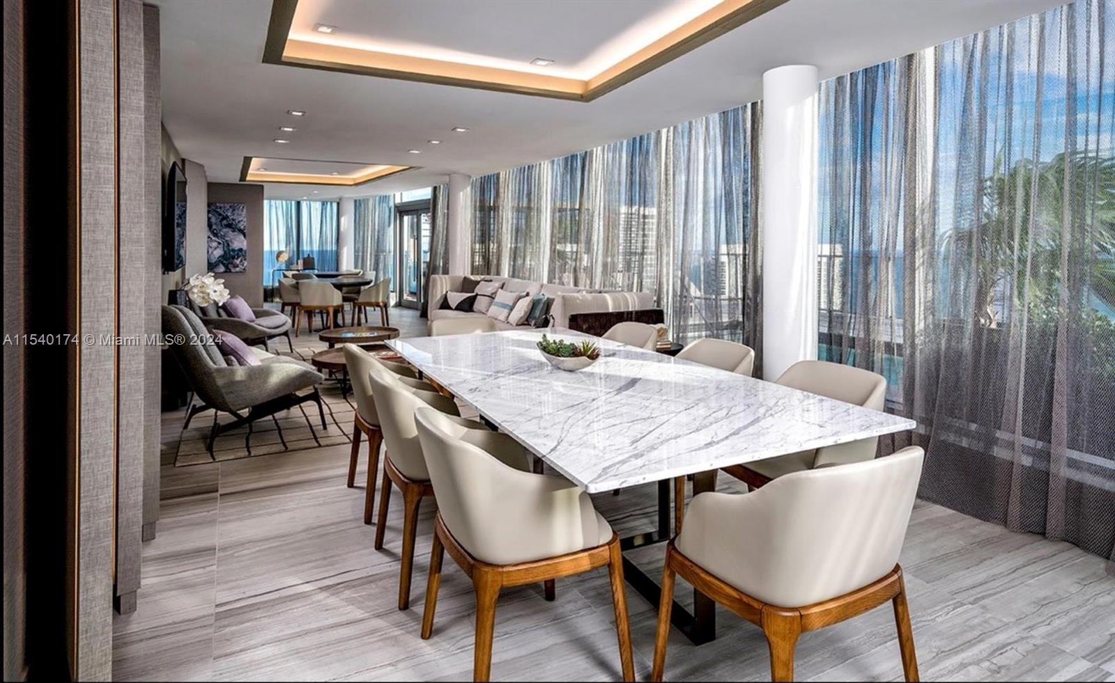 4010 South Ocean Drive, Unit R703 Hollywood, FL 33019 - Photo 18 of 37 a dining room with furniture and wooden floor