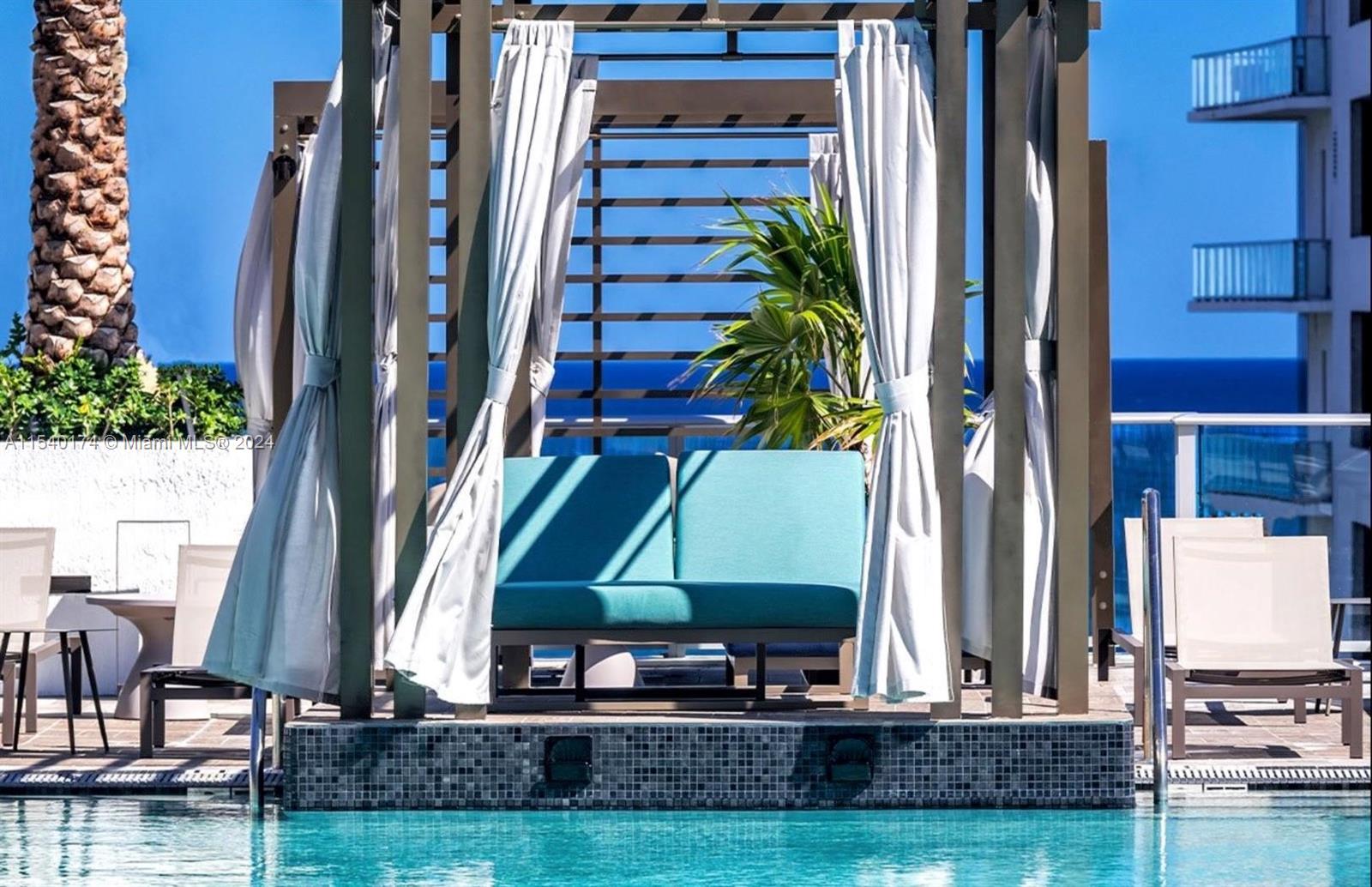 4010 South Ocean Drive, Unit R703 Hollywood, FL 33019 - Photo 21 of 37 a view of a house with a yard