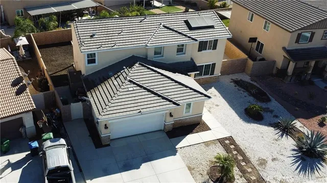 a view of a patio with table and chairs a barbeque with wooden floor and fence