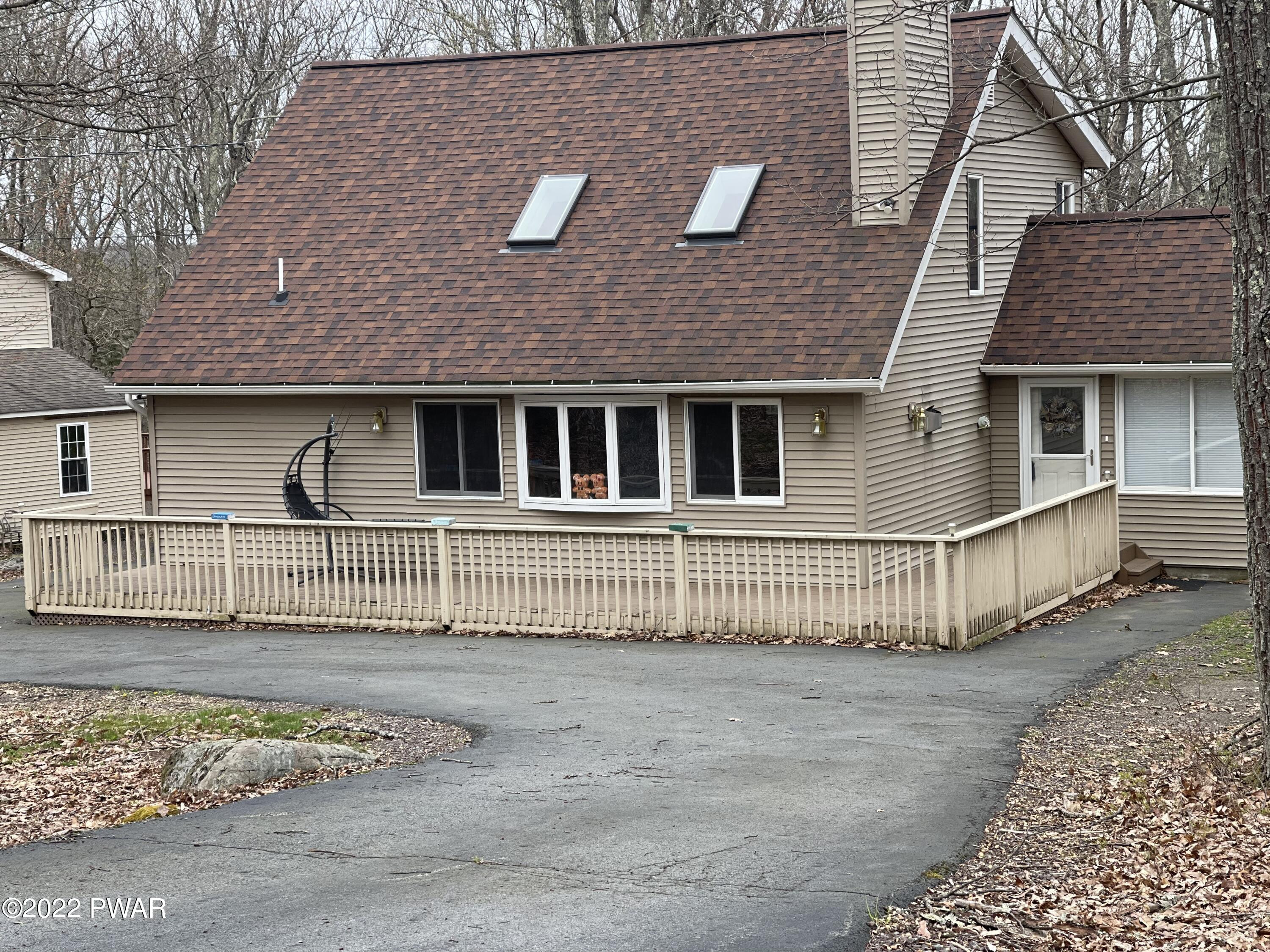 149 Rodeo Drive Hawley, PA 18428 - Photo 21 of 34 a front view of a house with a yard
