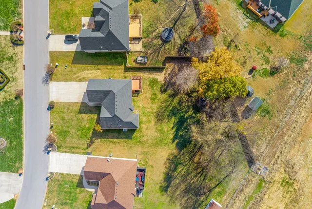an aerial view of a house with swimming pool
