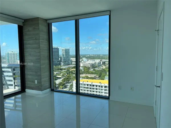 a view of a glass door with a large window