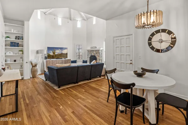 a view of a dining room with furniture and chandelier