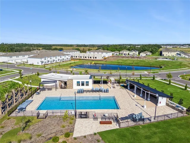 an aerial view of a city with lawn chairs