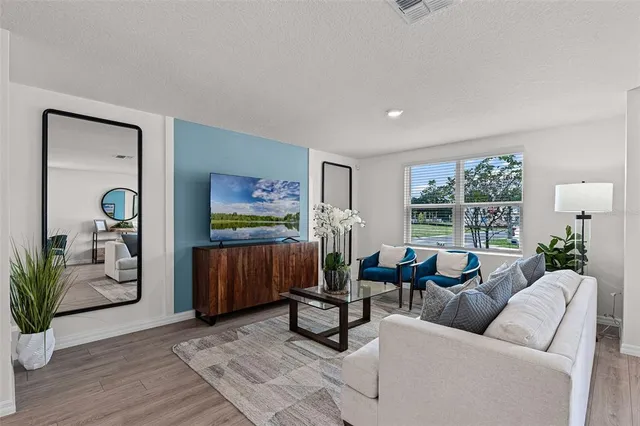 a living room with furniture and a window