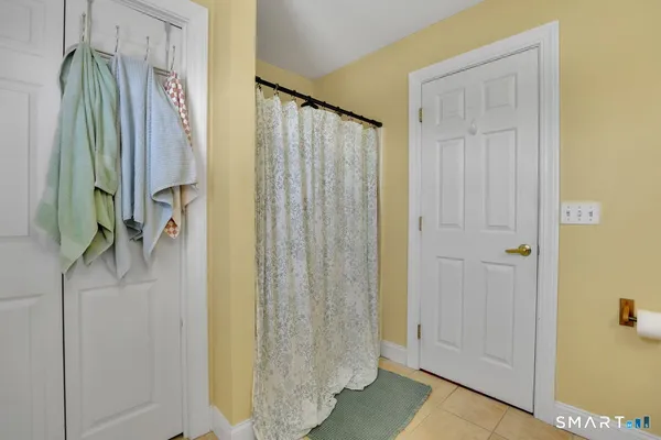 a bathroom with a shower and a tub
