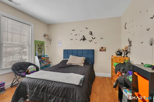 a bedroom with furniture and a bed