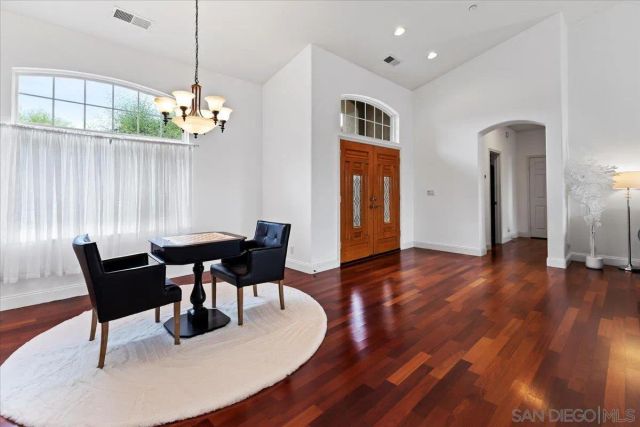 a kitchen with stainless steel appliances kitchen island granite countertop a refrigerator and a stove top oven