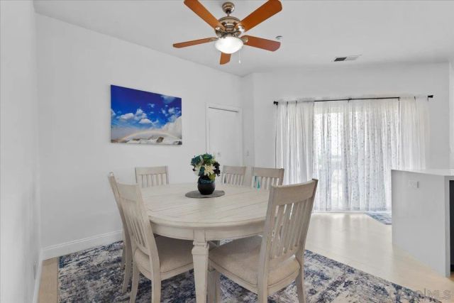a living room with fireplace furniture and a flat screen tv