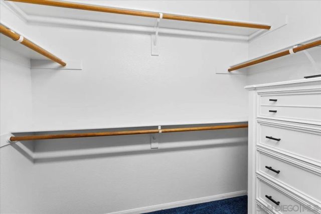 a building outdoor space with patio furniture and potted plants