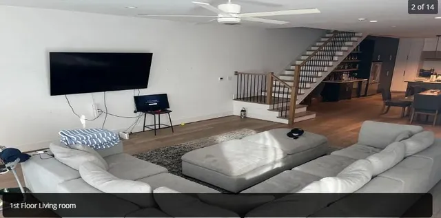 a living room with furniture and a flat screen tv