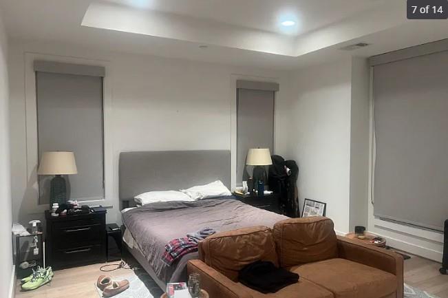 3324 Rosedale Avenue University Park, TX 75205 - Photo 6 of 11 a bedroom with a bed and a lamp on dresser