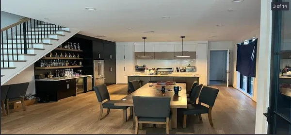 a dining room with furniture and wooden floor