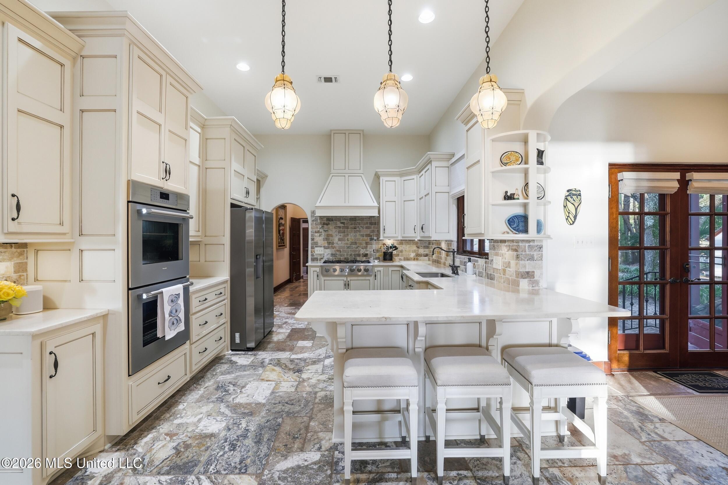 13801 Arbor Circle Ocean Springs, MS 39564 - Photo 15 of 95 KITCHEN EAT IN BAR LOOKING OVER GALLEY