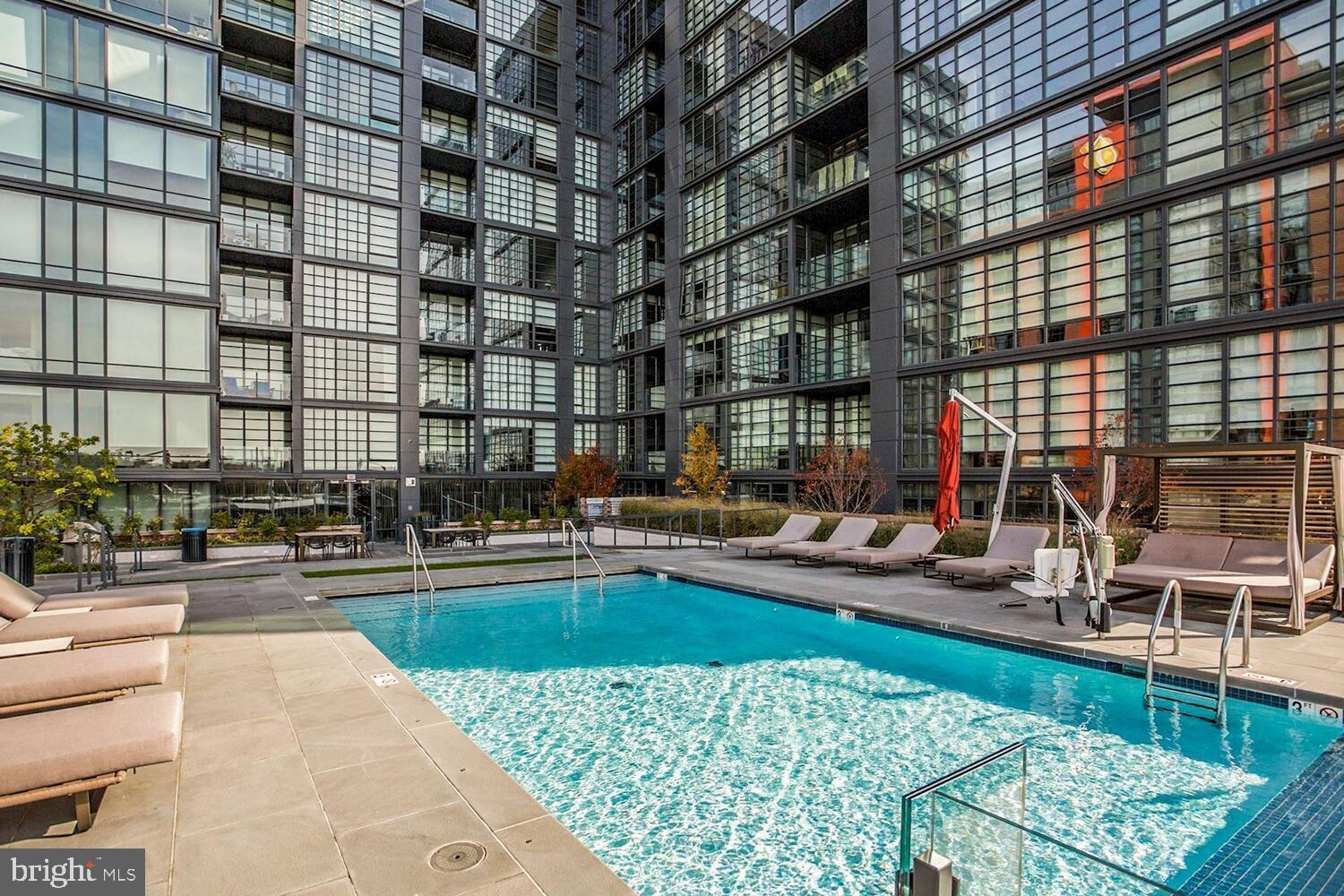 45 Sutton Square Southwest, Unit 1118 Washington, DC 20024 - Photo 52 of 65 Modern oasis with a sparkling pool.