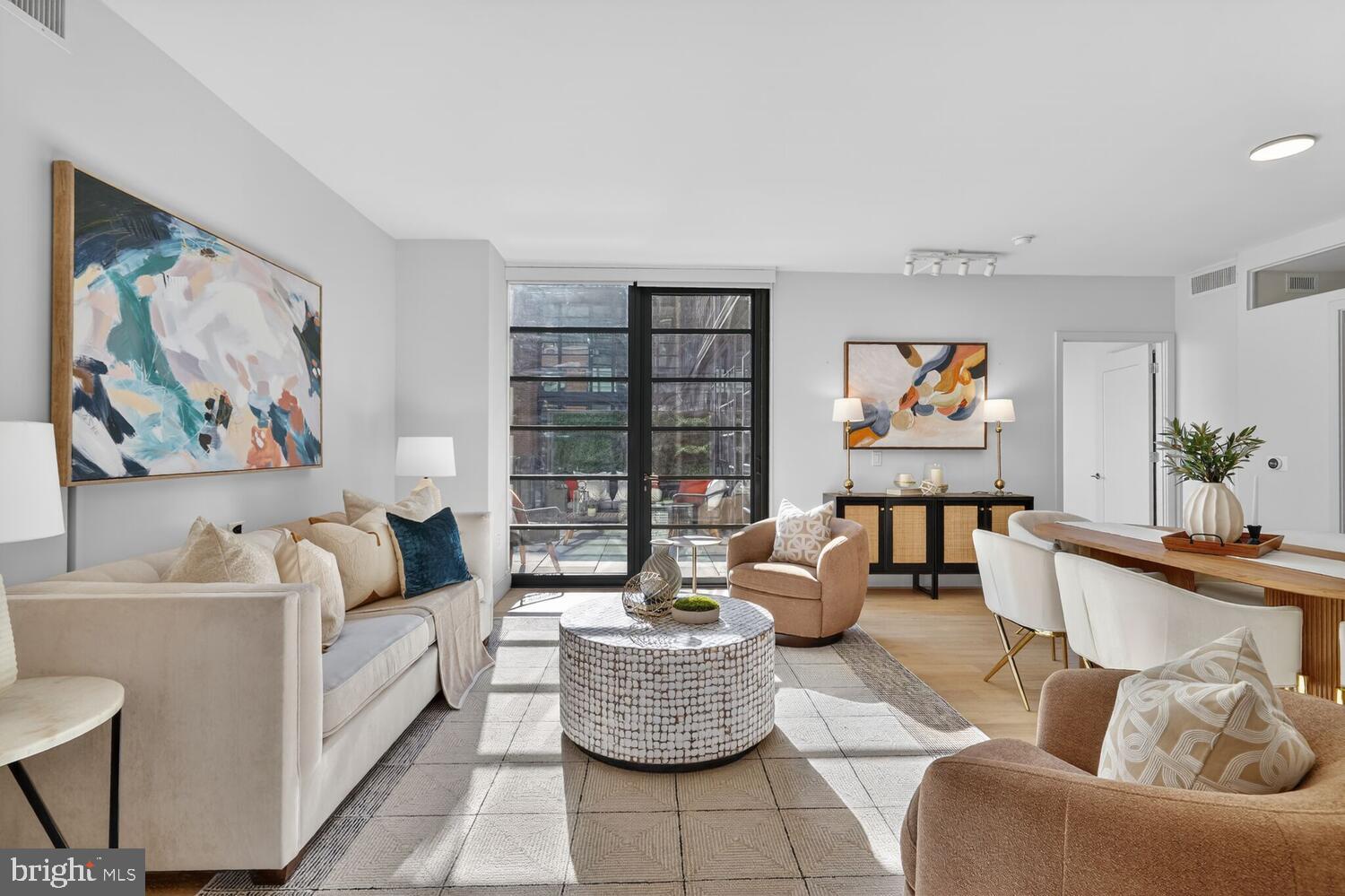 45 Sutton Square Southwest, Unit 1118 Washington, DC 20024 - Photo 10 of 65 Open living w/a wall of windows & terrace access