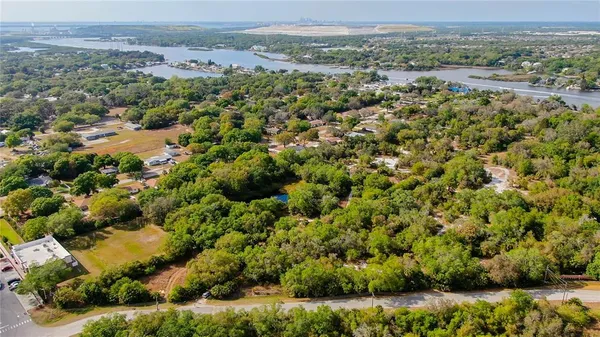 an aerial view of a houses with a yard
