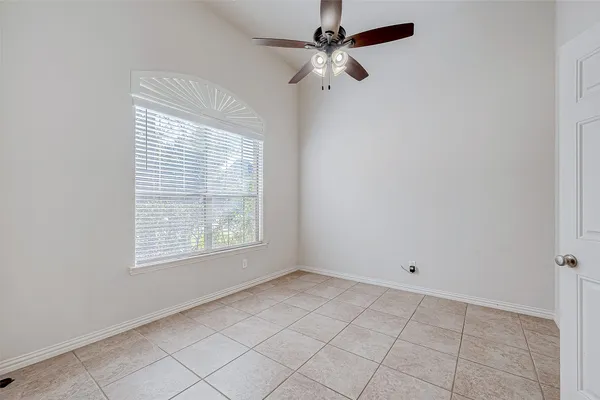 a view of an empty room with a fireplace