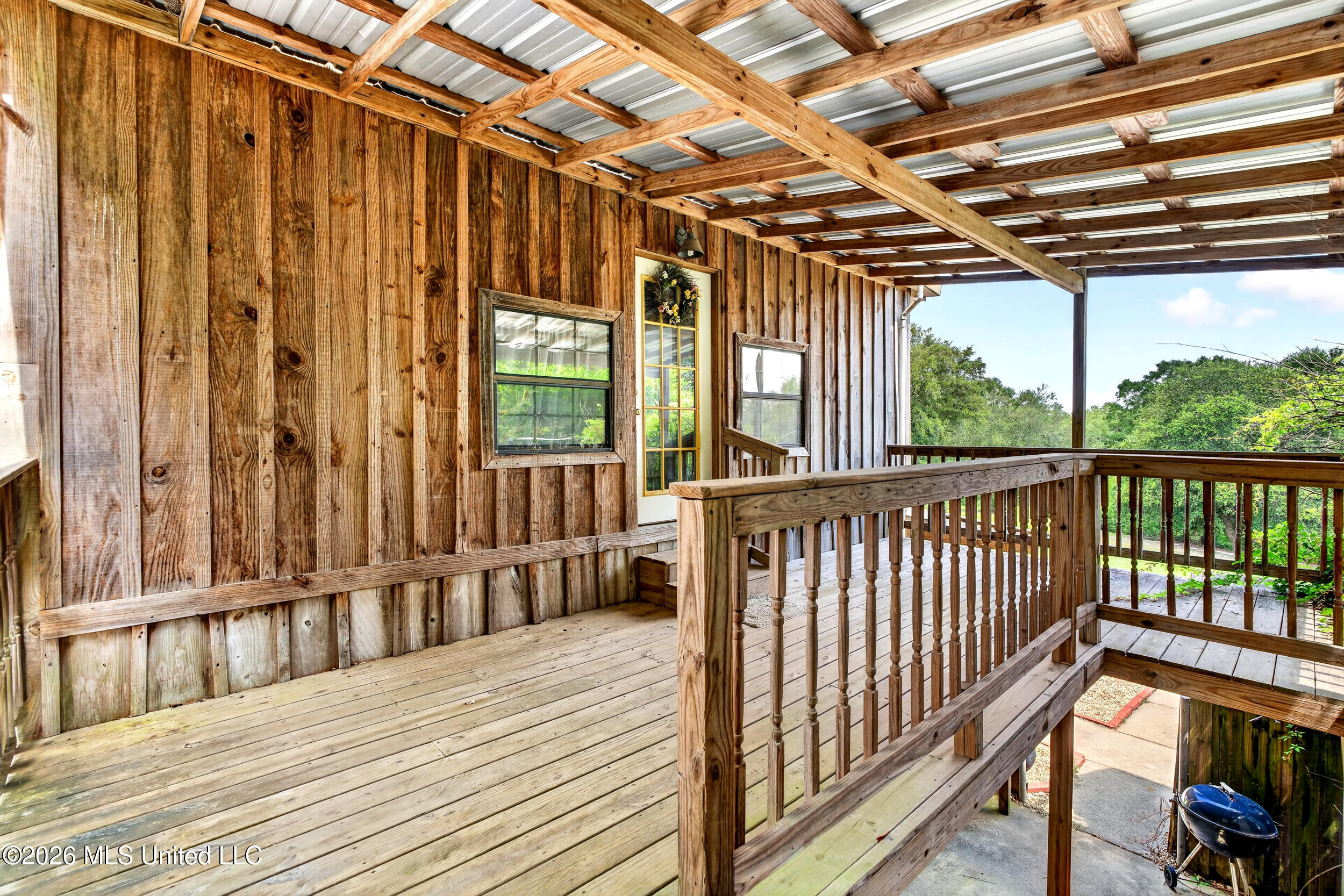 574 Slade Woodward Road Poplarville, MS 39470 - Photo 55 of 106 56_upstairs_apartment_porch
