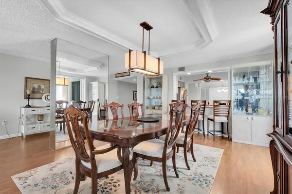 a dining room with furniture and wooden floor