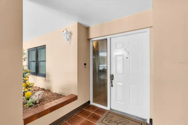 a view of room with wooden floor and bathroom