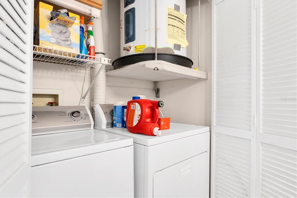 6500 Sunset Way, Unit 316 St. Pete Beach, FL 33706 - Photo 28 of 58 a utility room with dryer and washer
