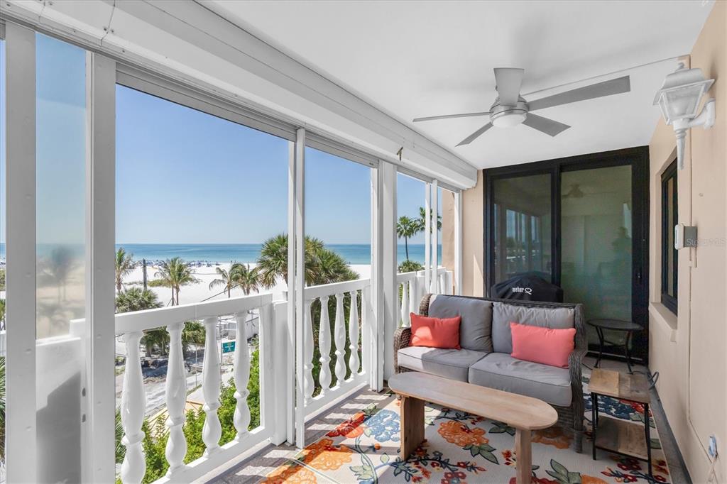 6500 Sunset Way, Unit 316 St. Pete Beach, FL 33706 - Photo 34 of 58 a living room with furniture and a floor to ceiling window