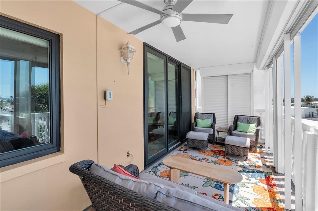 6500 Sunset Way, Unit 316 St. Pete Beach, FL 33706 - Photo 36 of 58 a living room with furniture and a window
