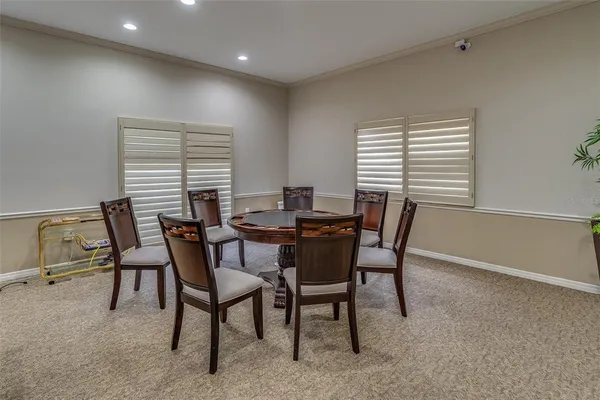 a view of a a dining room with furniture window and wooden floor