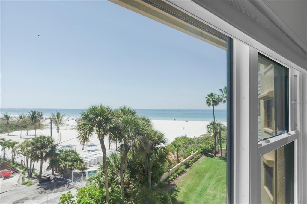6500 Sunset Way, Unit 316 St. Pete Beach, FL 33706 - Photo 10 of 58 a view of a lake from a balcony