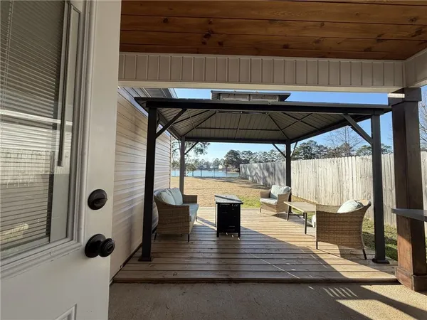 a view of outdoor seating space with wooden floor