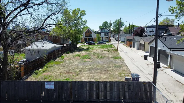 a view of a backyard with sitting area