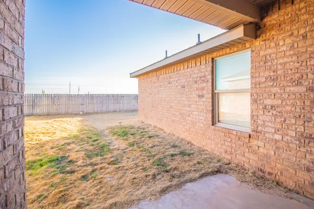 a view of a backyard of the house