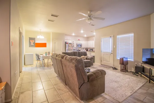 a living room with furniture and a flat screen tv