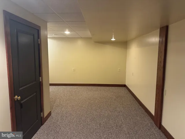 a kitchen with refrigerator and table