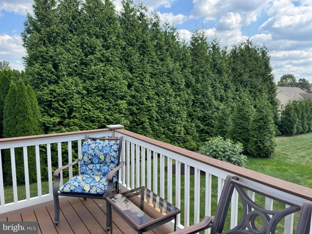 a view of a chair and table in the balcony