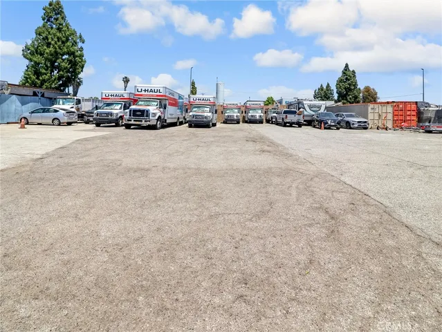 a view of cars parked in front of a building