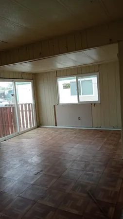 a view of an empty room and window