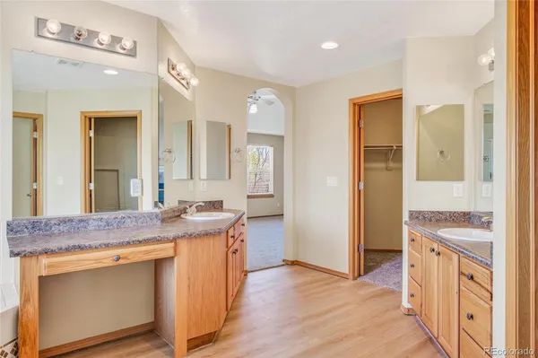 a view of a kitchen counter space and wooden floor