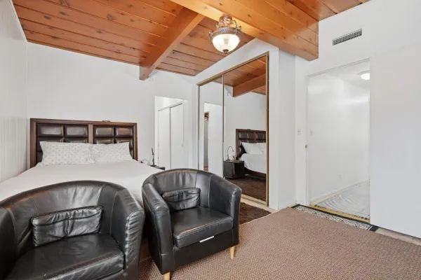 a bedroom with a bed and furniture