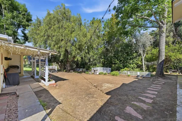 a view of a house with a yard and garage